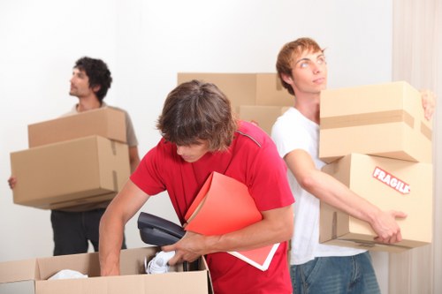 Professional office movers handling equipment during a Rotherhithe business move