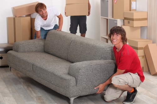 Removal van with professional movers handling belongings