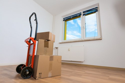 Specialist movers transporting a piano through a Rotherhithe property