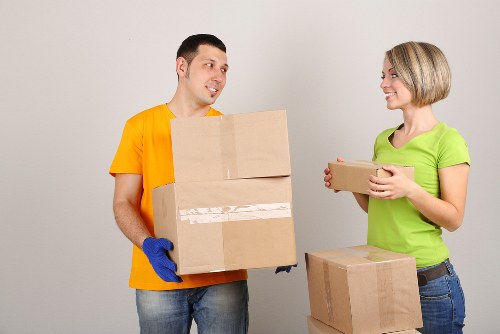 Professional movers loading furniture for a Rotherhithe house move